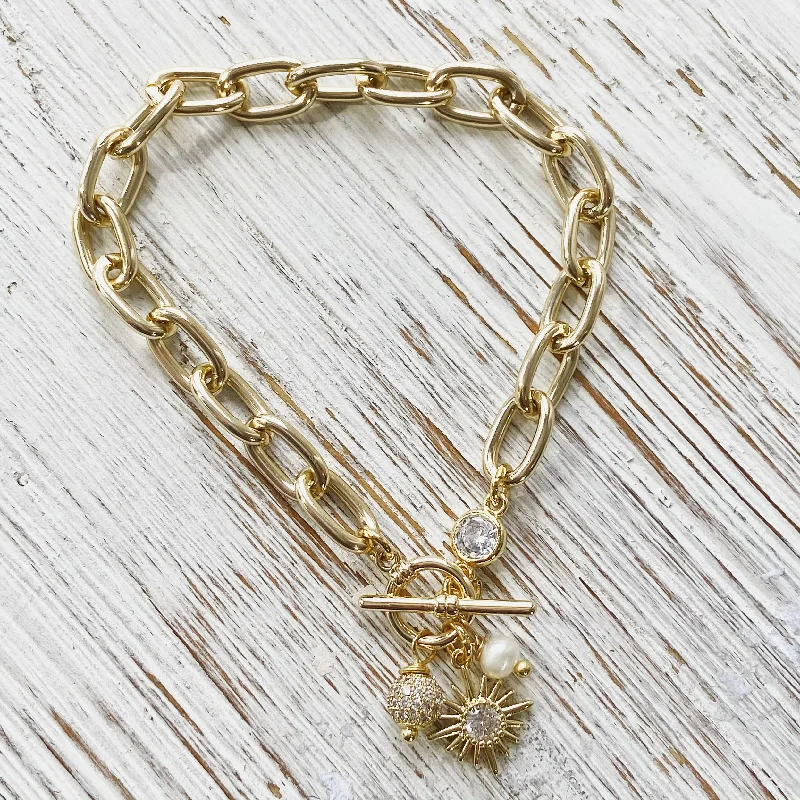 Sparkle In Style With Our Best Jewelry Deals Chunky gold chain bracelet, sun, pearl,boutique, salon,