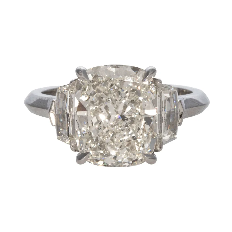 Elevate Your Jewelry Collection With Limited-Time Savings 4ct Cushion Center & .62ct Side Diamond Three-Stone Platinum Ring