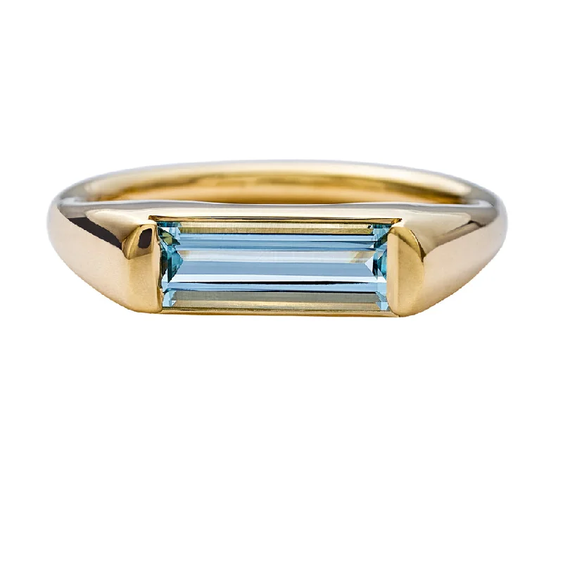 Modern Solitaire Ring with a Baguette Cut Aquamarine