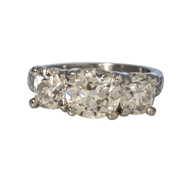 Vintage Round Diamond Three-Stone Platinum Ring