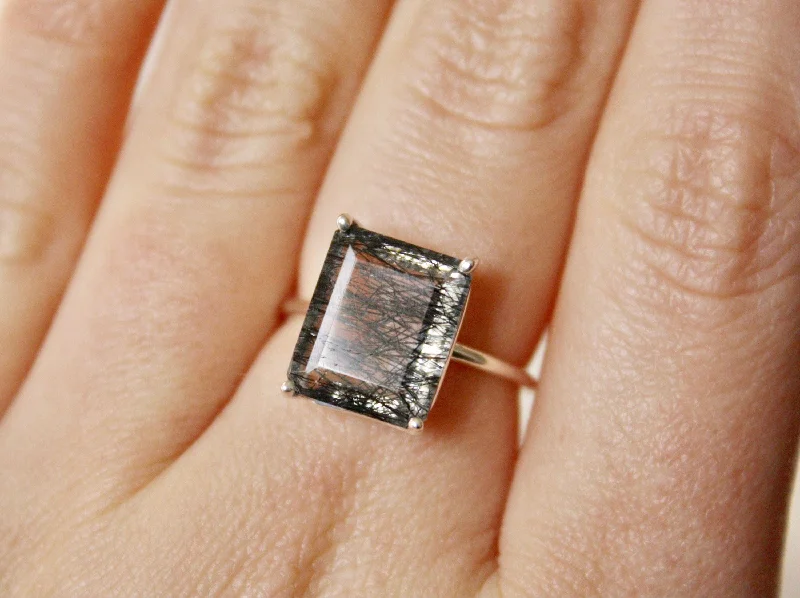Shop Dazzling Jewelry With Special Promotional Discounts Tourmalinated Quartz Ring, 12x10 Emerald Cut Shop Dazzling Jewelry With Special Promotional Discounts Tourmalinated Quartz Ring, 12x10 Emerald Cut